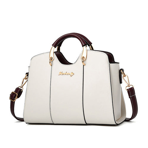 Elegante Damenhandtasche in Weiß mit schwarzen Details und goldenen Akzenten - vielseitig kombinierbare Schultertasche mit Riemen