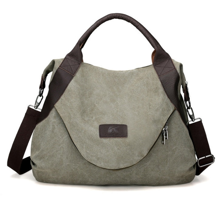 Damen Canvas Handtasche im Vintage-Look mit Lederdetails und verstellbarem Schultergurt in Khaki.