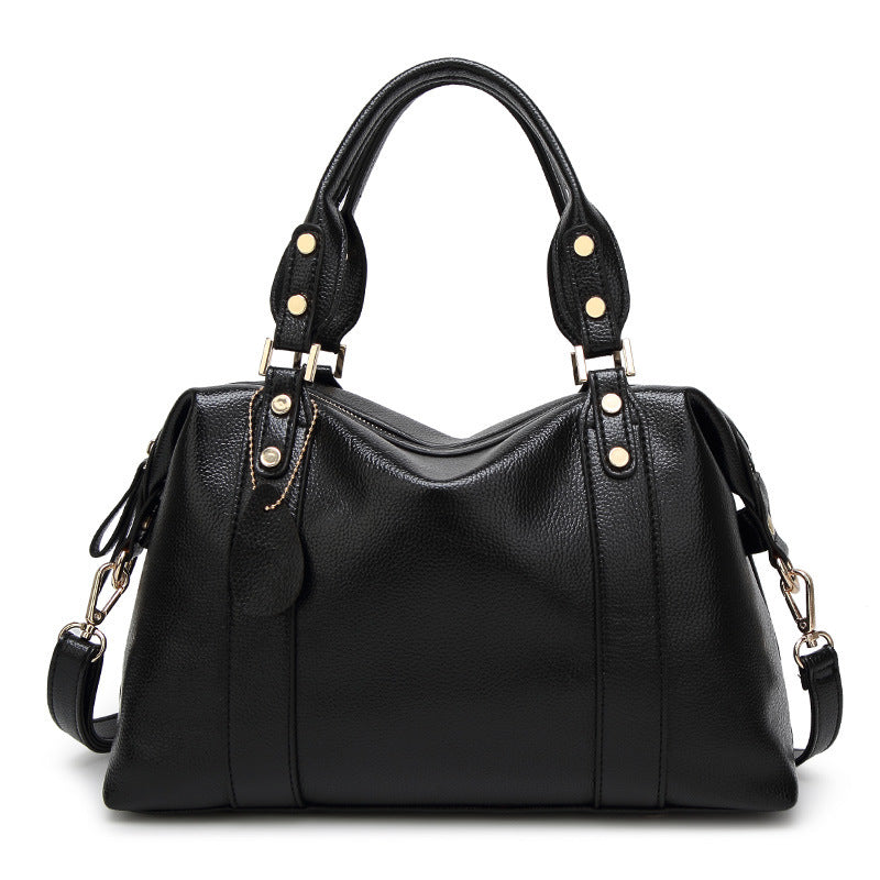 Elegante Damenhandtasche in Schwarz mit Lychee-Struktur, goldenen Details - Vorderansicht mit Griffen und Schulterriemen