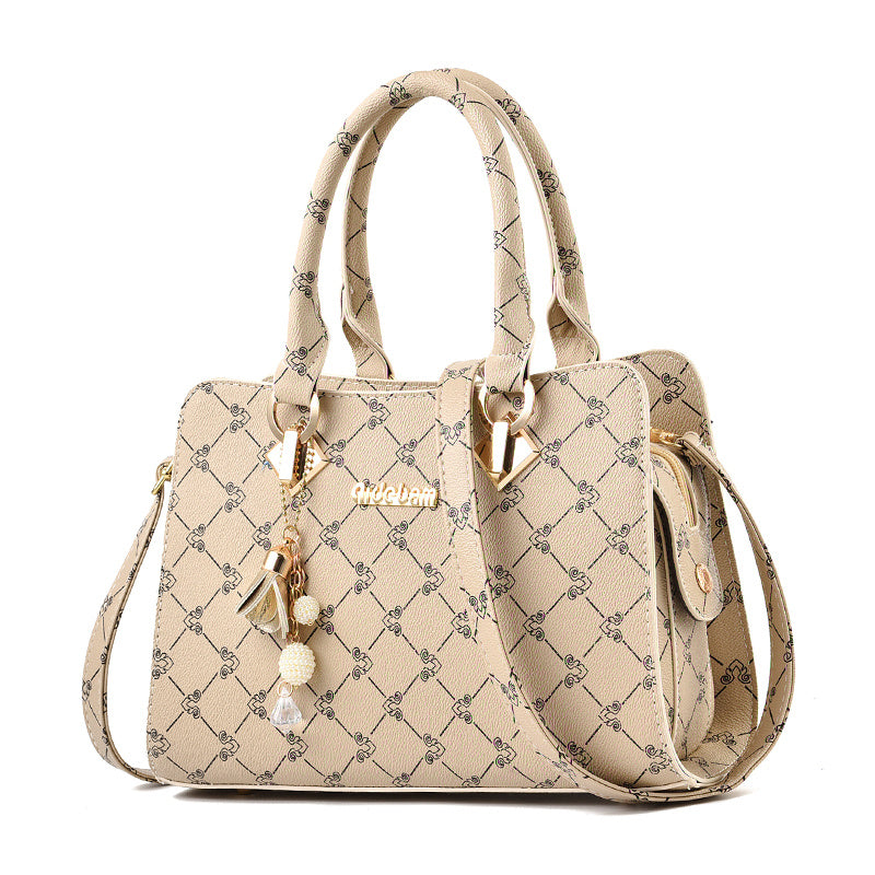 Stilvolle Damen Handtasche mit geometrischem Muster aus PU-Leder, mit Anhänger und Schulterriemen.