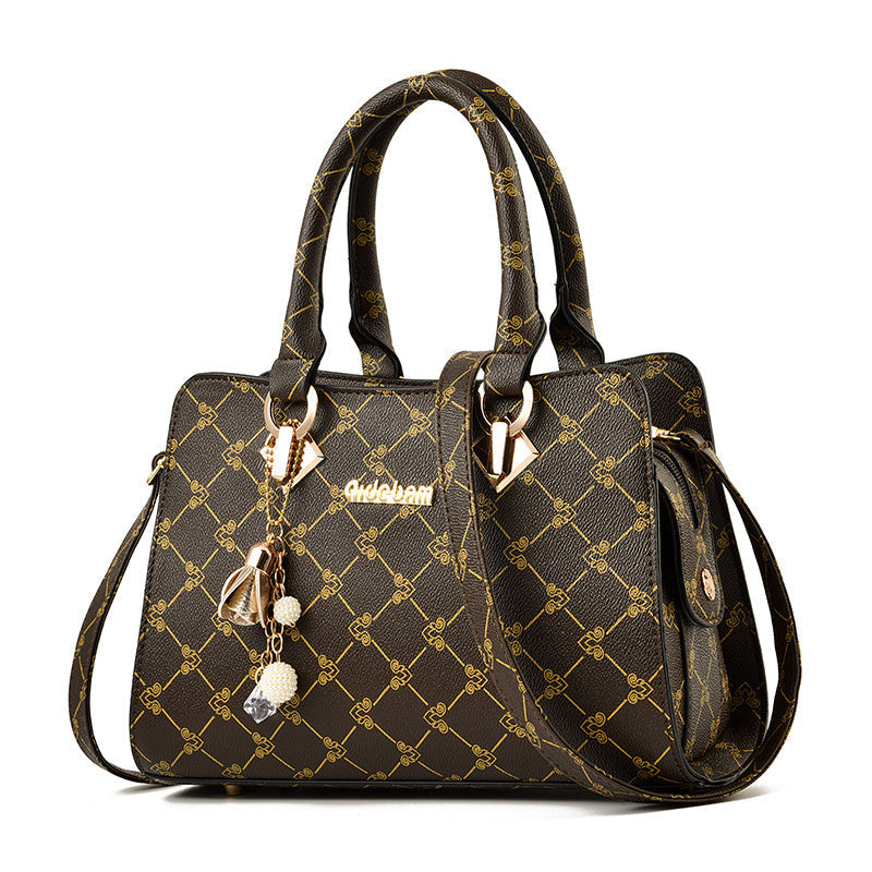 Stilvolle Damen Handtasche mit geometrischem Muster aus PU-Leder, inklusive Anhänger und Schulterriemen.