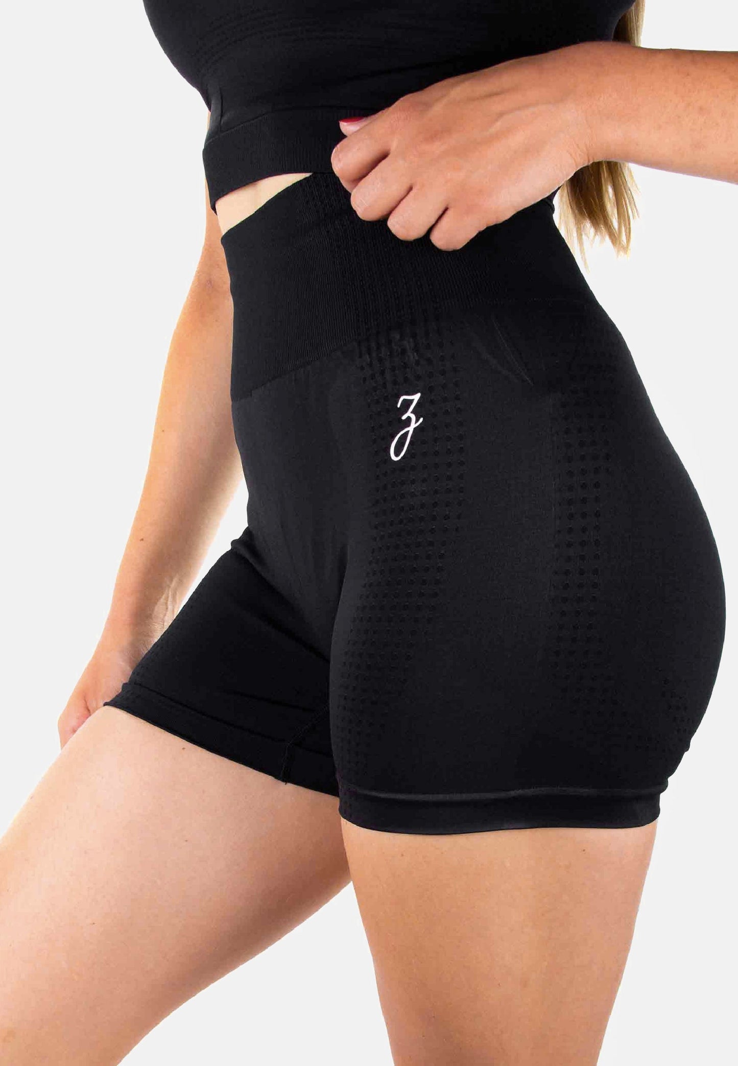 Black body-hugging women's dynamic shorts made of nylon and spandex for sports and casual wear